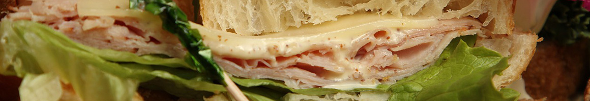 Eating Deli Sandwich at Main Street Deli restaurant in Churchville, NY.